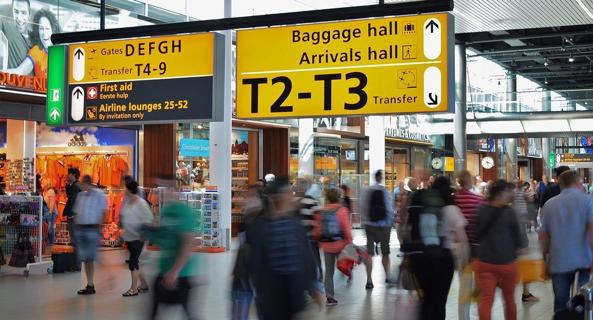 People walking at an airport shopping area