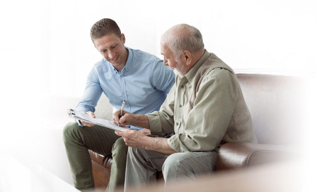 Two men discussing over a piece of paper
