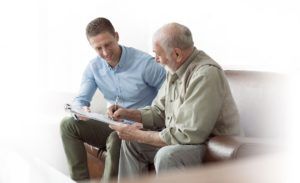 Two men discussing over a piece of paper