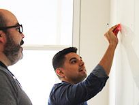 People working on a white board